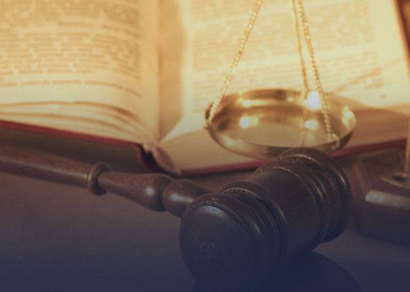 Gavel, scale, and open law book.