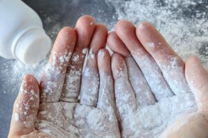What type of ovarian cancer is caused by talc?