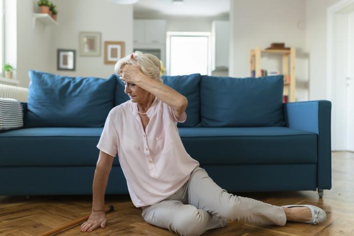 elderly lady sitting on floor after a fall