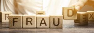 Fraud spelled out in scrabble letters