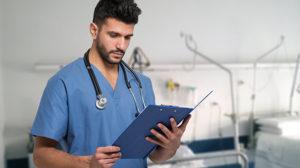 Nurse texting while ignoring elderly patient