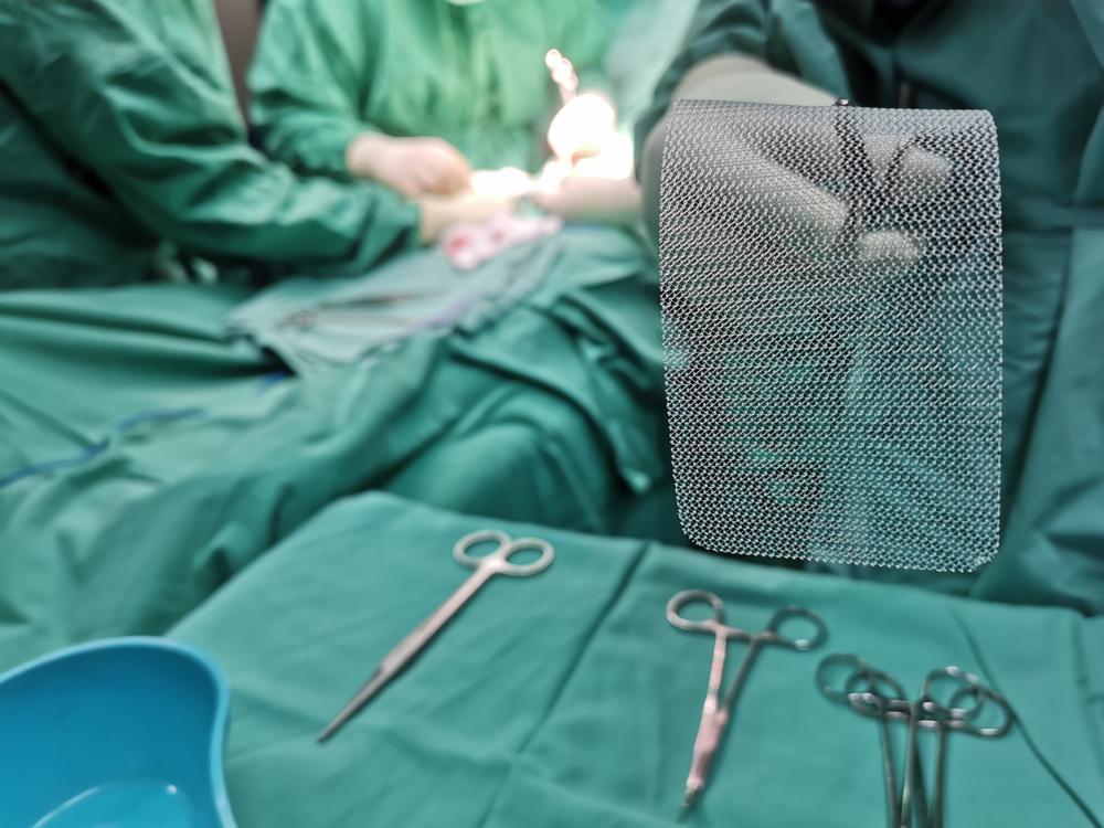 a surgeon about to implant pelvic mesh