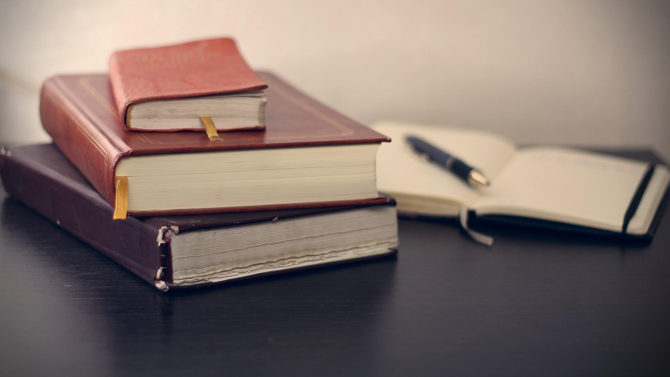 Stack of books on a table.